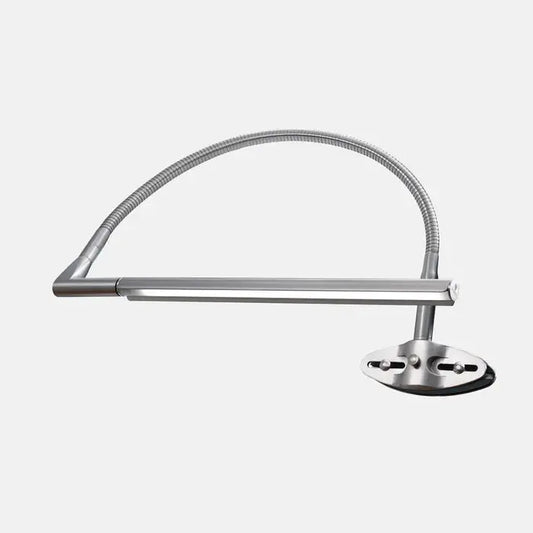 Daylight D35000 Techne Lamp on a desk setup for artist use
Adjustable arm of Daylight Techne drafting lamp in motion
Close-up of LED light head on Techne D35000 for detailed work