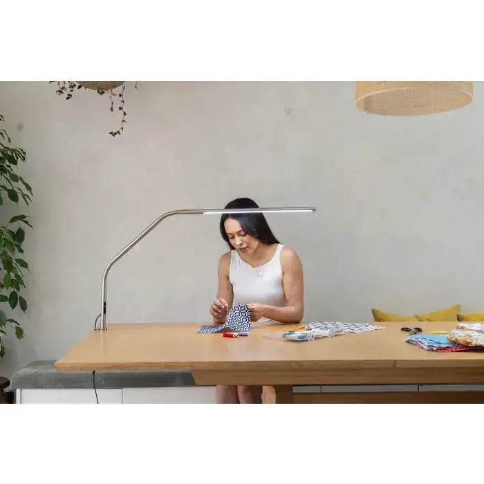 Daylight D35109 Slimline 4 Table Lamp on a minimalist desk
Slimline 4 lamp lighting a detailed artwork in progress
Side profile of Daylight Slimline 4 lamp with clamp base