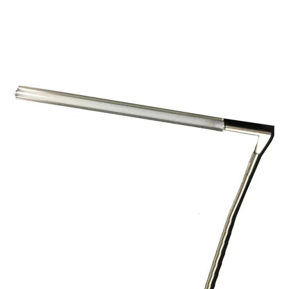 Daylight D35000 Techne Lamp on a desk setup for artist use

Adjustable arm of Daylight Techne drafting lamp in motion

Close-up of LED light head on Techne D35000 for detailed work