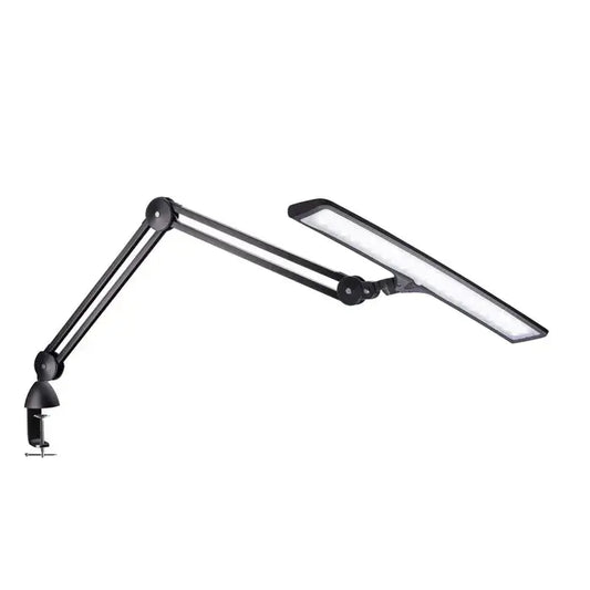 Side view of Daylight UnoPro lamp with ergonomic design

Daylight DN1450 UnoPro lamp in a modern home office setup

LED light head of UnoPro Table Lamp angled for close-up tasks

