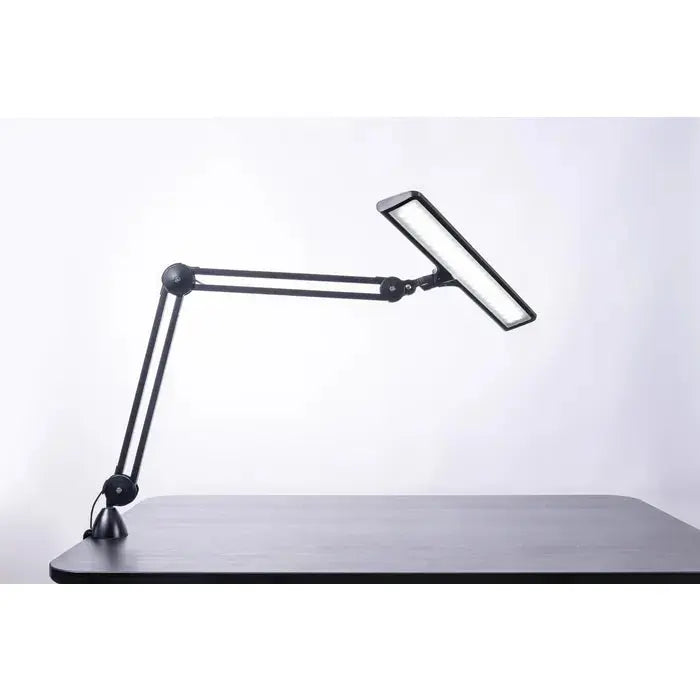 Side view of Daylight UnoPro lamp with ergonomic design

Daylight DN1450 UnoPro lamp in a modern home office setup

LED light head of UnoPro Table Lamp angled for close-up tasks

